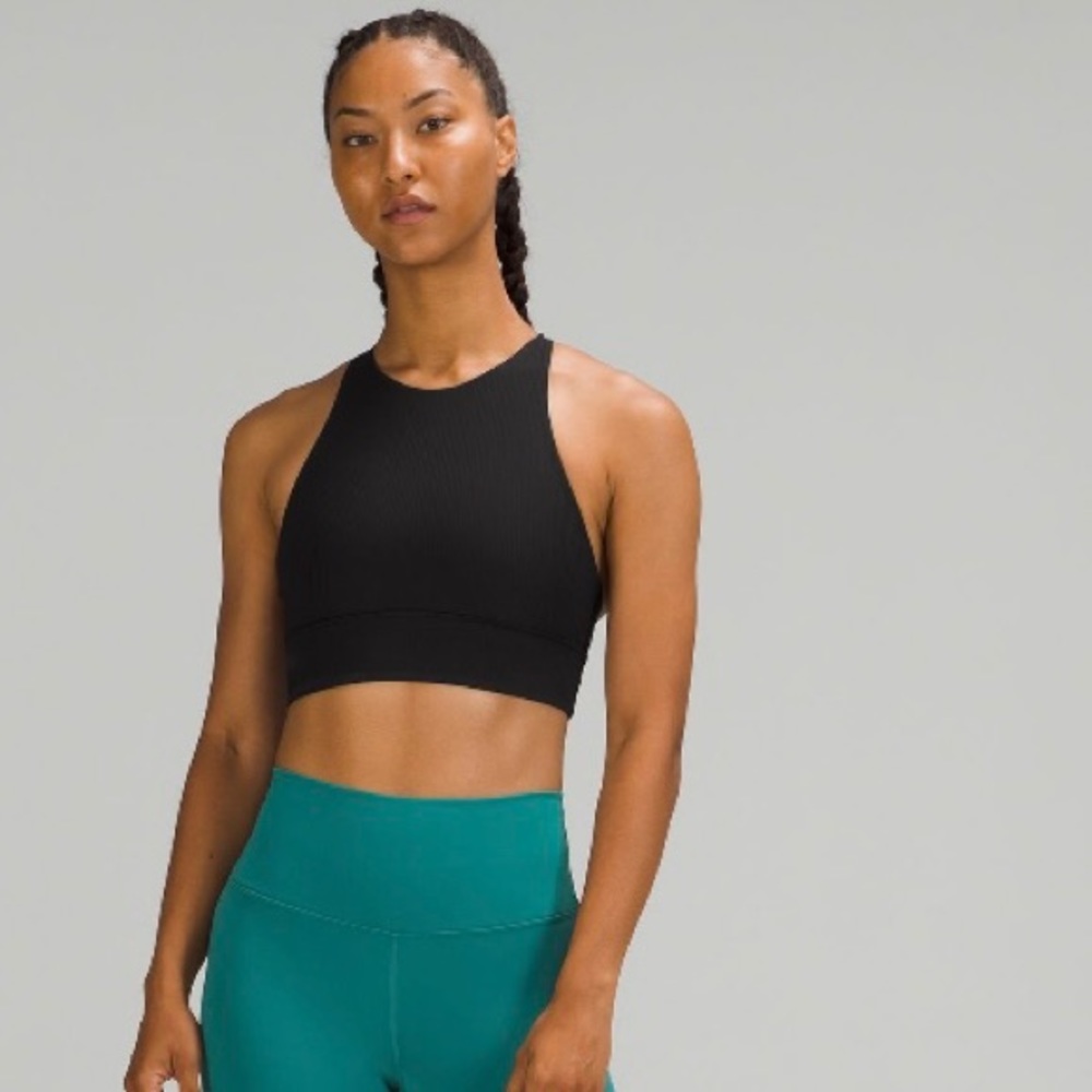 Energy Bra size 6, high neck black ribbed long line. Good condition, no padding.